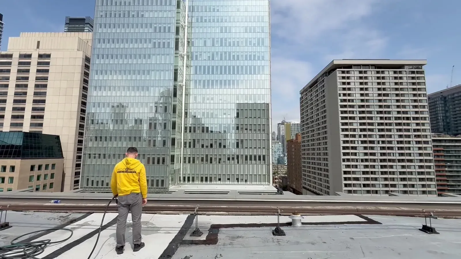 A Moderno crew member on a downtown Toronto rooftop